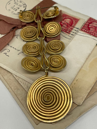 1970’s Matte Gold Spiral Brooch with Purple Rhinestones Devil's Details